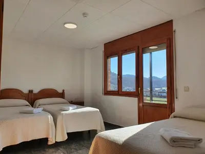 Cama o camas de una habitación en Hostal Apolo XI