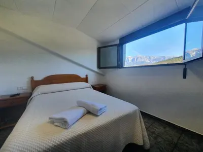 Cama o camas de una habitación en Hostal Apolo XI