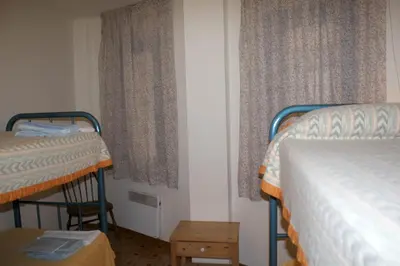 Cama o camas de una habitación en Apartamentos Pessets Adelaida
