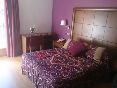 Cama o camas de una habitación en Hotel Casa Chuldian