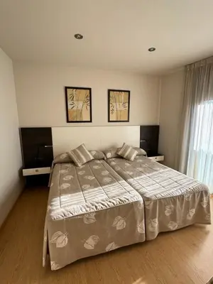 Cama o camas de una habitación en Apartamentos Turísticos Can Rocamora