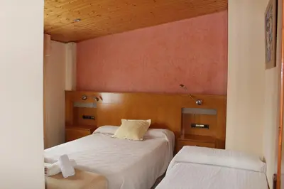 Cama o camas de una habitación en Apartamentos Turísticos Can Rocamora