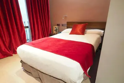 Cama o camas de una habitación en Hotel Palacio del Obispo