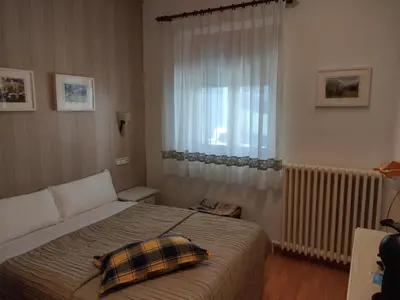 Cama o camas de una habitación en Hostal Escartín