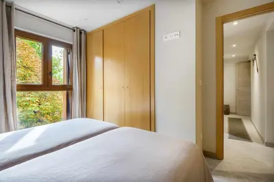 Cama o camas de una habitación en MONTELIA Ático El Ciervo de Panticosa