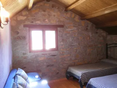 Cama o camas de una habitación en Casa Rural Tomaso II