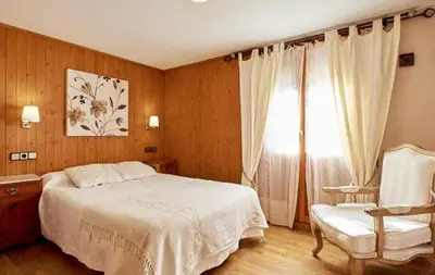 Cama o camas de una habitación en Hostal Vidaller
