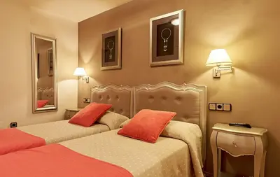 Cama o camas de una habitación en Hostal Vidaller