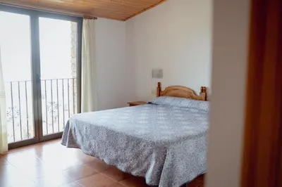 Cama o camas de una habitación en El Portal de la Irene - Apartamentos Rurales