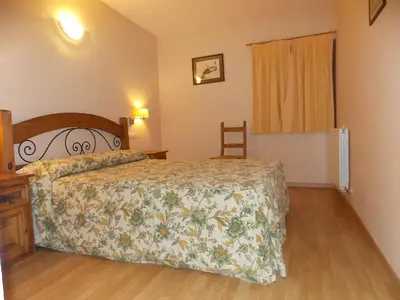 Cama o camas de una habitación en Apartamentos Fidalgo