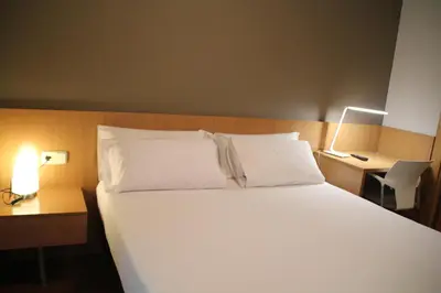 Cama o camas de una habitación en Hostal Abodi
