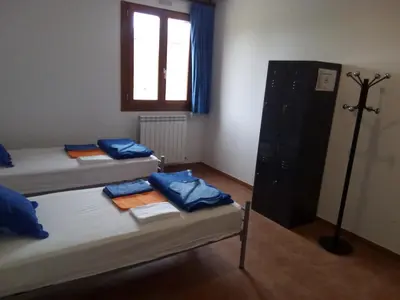 Cama o camas de una habitación en Albergue Turístico Tierras Altas