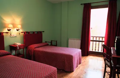 Cama o camas de una habitación en Posada del Almudí