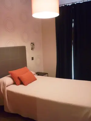 Cama o camas de una habitación en Posada del Almudí