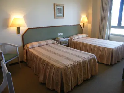 Cama o camas de una habitación en Hotel Magallón