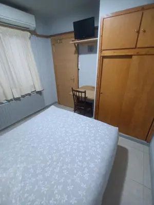 Cama o camas de una habitación en Hostal Can Jaume