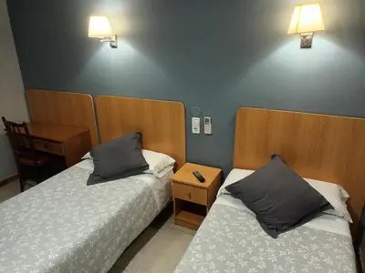 Cama o camas de una habitación en Hostal Can Jaume