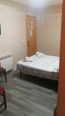 Cama o camas de una habitación en Hostal Escarla