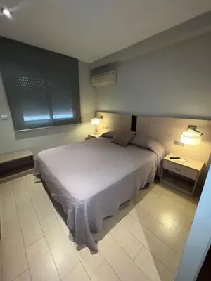 Cama o camas de una habitación en Hostal Crisami