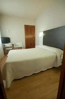 Cama o camas de una habitación en Hotel Fornos