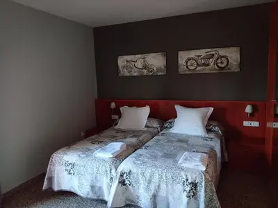 Cama o camas de una habitación en Hostal Casa Barranco