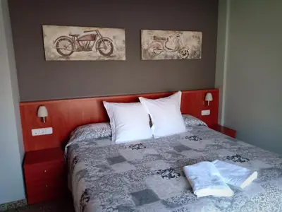 Cama o camas de una habitación en Hostal Casa Barranco