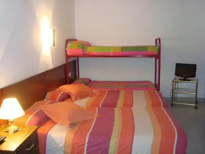 Cama o camas de una habitación en Hostal Les Collades