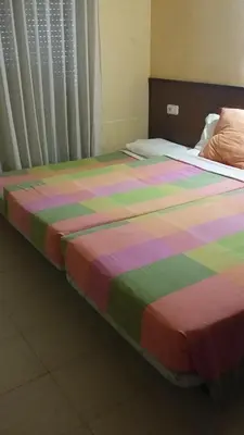 Cama o camas de una habitación en Hostal Les Collades