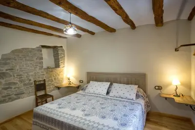 Cama o camas de una habitación en Casa rural La Masadría