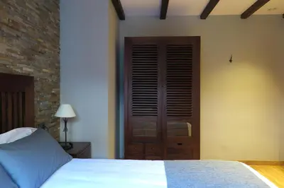 Cama o camas de una habitación en Apartamentos Casa Pochetas
