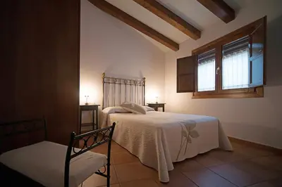Cama o camas de una habitación en Apartamentos Casa Vidal