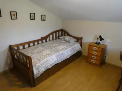 Cama o camas de una habitación en Casa con jardín frente ciudadela