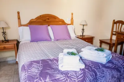 Cama o camas de una habitación en Apartamentos Maribel