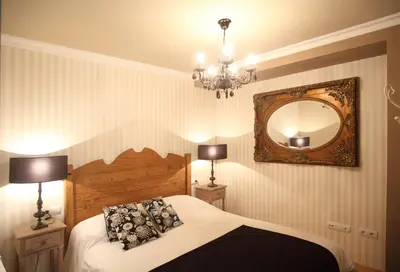 Cama o camas de una habitación en Apartamentos Alcoba de Baco