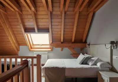 Cama o camas de una habitación en Apartahotel Tres Quiñones