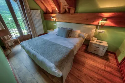 Cama o camas de una habitación en Apartahotel Tres Quiñones