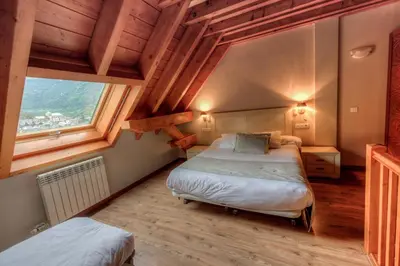 Cama o camas de una habitación en Apartahotel Tres Quiñones