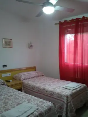 Cama o camas de una habitación en Hostal Restaurante el Cazador
