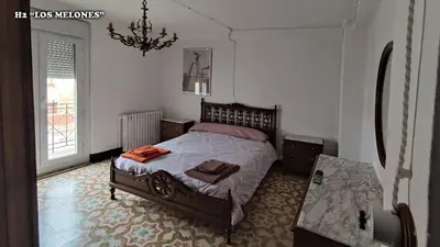 Cama o camas de una habitación en Casa rural L´Amparo -3 espigas- Categoría superior-15 personas