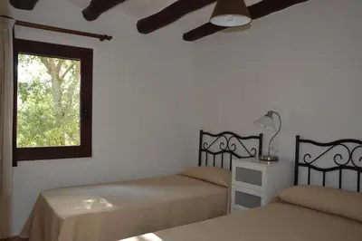 Cama o camas de una habitación en Mas de Bruquet