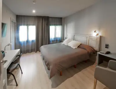 Cama o camas de una habitación en Hotel Jardí Apartaments