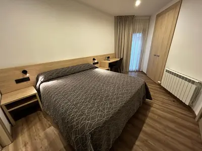 Cama o camas de una habitación en Hotel Jardí Apartaments