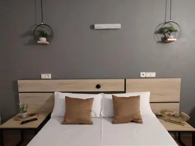 Cama o camas de una habitación en Hostal Turbon