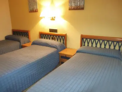 Cama o camas de una habitación en Hotel Villa de Utrillas