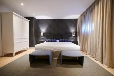 Cama o camas de una habitación en Hostal Lola