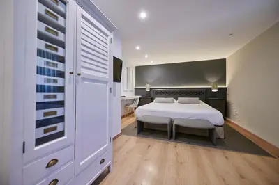 Cama o camas de una habitación en Hostal Lola
