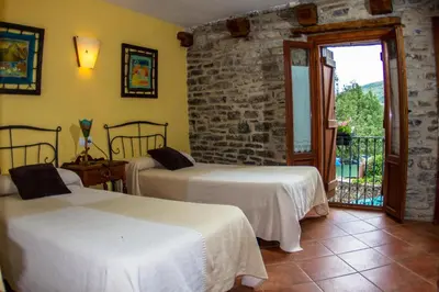 Cama o camas de una habitación en Casa Rural Basajarau