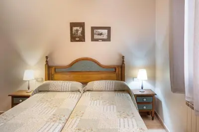 Cama o camas de una habitación en El Rincón de Andrea Apartamentos