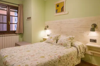 Cama o camas de una habitación en El Rincón de Andrea Apartamentos