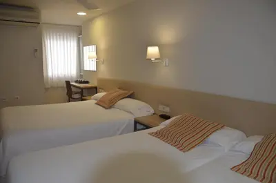 Cama o camas de una habitación en Hotel Balaguer